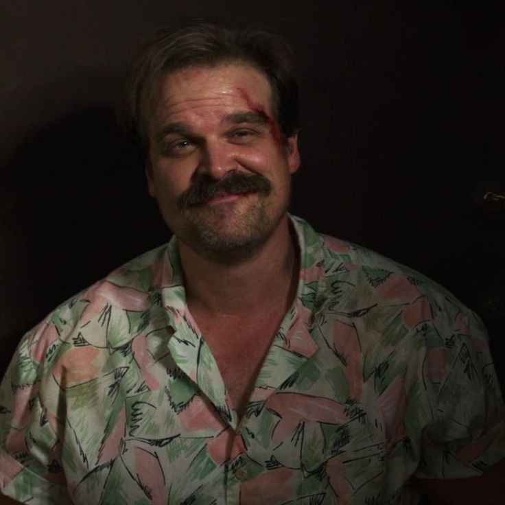 a man with a fake mustache wearing a shirt