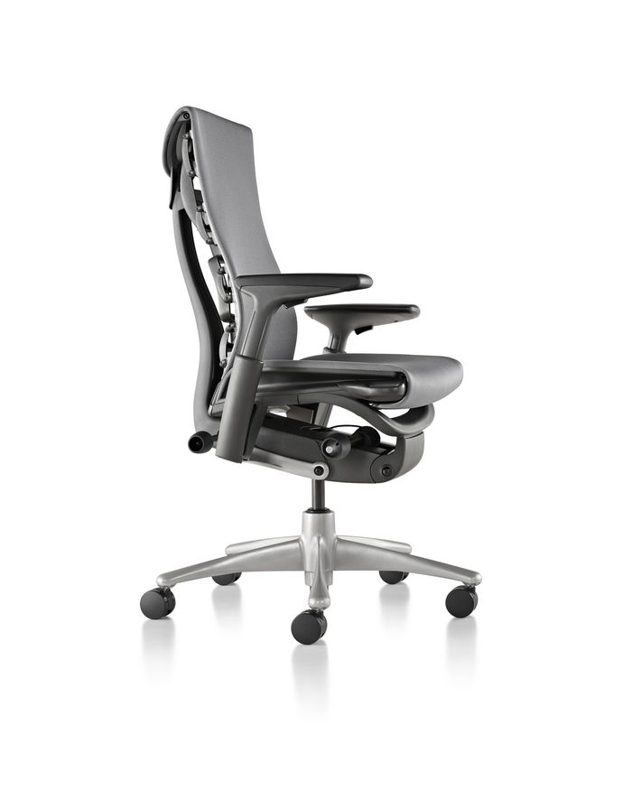 an office chair with wheels on the back and seat upholstered to the side