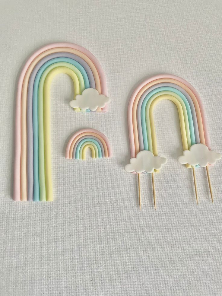 rainbows and clouds are arranged in the shape of letters