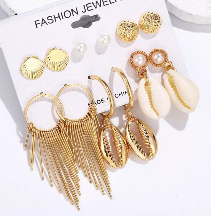 A set with styles to go with different outfits. This is a set of earrings every girl will find handy in their accessory closet. Perfect piece to buy when you can't choose between getting hoops or studs. Features Color- Gold Meterial- Zinc Alloy, Faux Pearls Type- Studs & Drop Earrings shipping weight 100g Please look below for shipping times: Canada Orders ship & arrive within 3 to 9 business days (CAN) International Orders may take up to 2-4 weeks for arrival. Rural cities may take long Accessory Closet, Pearl Earring Set, Crystal Pearl Earrings, Pearl Types, Different Outfits, Shell Earrings, Stud Earrings Set, Pearl Stud Earrings, Metal Earrings