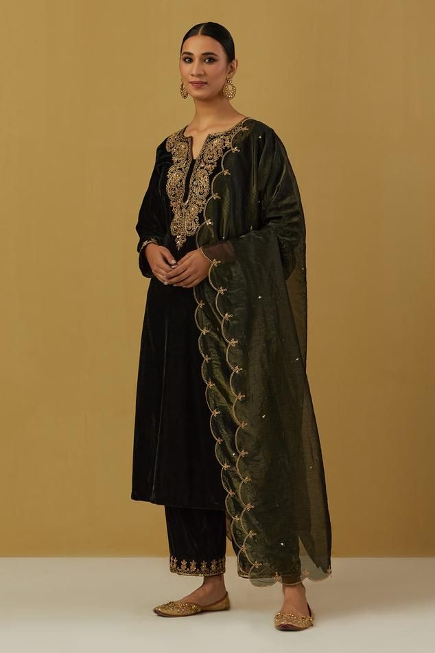 Black velvet silk embroidered kurta in paisley and floral motifs. Paired with embroidered hem pant and scallop dupatta.
Component: 3
Pattern: Embroidered
Type Of Work: Paisley, Floral
Neckline: Notched
Sleeve Type: Long
Fabric: Silk Velvet, Shimmer Organza
Color: Black
Other Details: 
Scallop dupatta
Embroidered hem pant
Occasion: Sangeet - Aza Fashions Maroon Suit, Velvet Kurta, Linen Style Fashion, Velvet Dress Designs, Kurta Pant Set, Aesthetic Dress, How To Hem Pants, Kurta With Pants, Colored Wedding Dresses