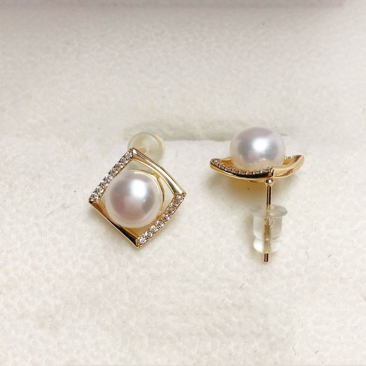 Minimalist Elegance. These chic earrings showcase lustrous freshwater pearls, framed by subtle square zircons for a touch of sparkle. Perfect for everyday sophistication. Pearl Type: Freshwater Pearls Pearl Quality: [Shape]: Flattened Round [Size]: 8-9mm [Blemish]: Minimal - None [Luster]: High Material: Thick 18k Gold Plated Brass Note: Every pearl is unique. Items may vary from the pictures. Elegant Square Earrings For Anniversary, Elegant Square Earrings For Formal Occasions, Elegant Rectangular Pearl Drop Earrings, Elegant Square Wedding Jewelry, Freshwater Pearl Earrings, Chic Earrings, Freshwater Pearls Earrings, Pearl Types, Simple Earrings