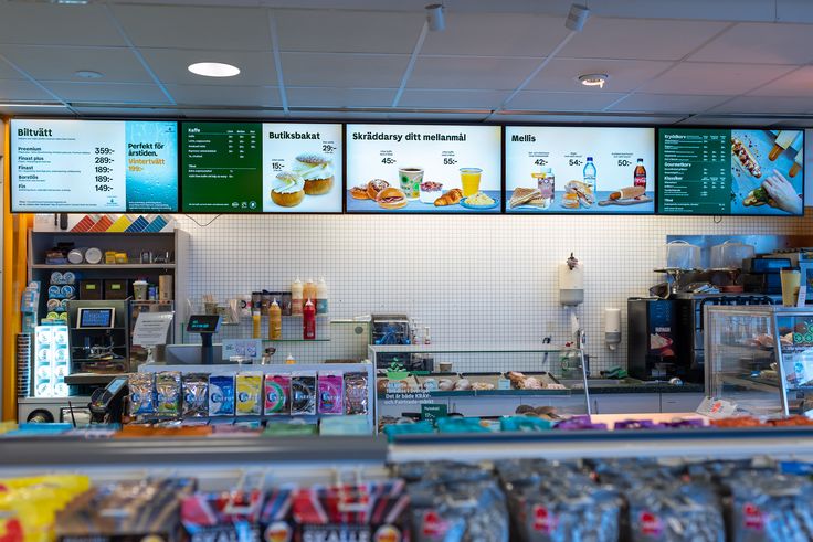 the inside of a fast food restaurant with menus