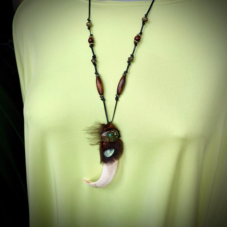 "This tribal boar tooth pendant with turquoise and labradorite cabochons and sheep fur on adjustable cord could become a nice talisman / amulet, \"spiritual guardian\" 🙃😉 Pendant size is ~4\" (10cm). Leather cord length can be adjusted in accordance with your preferences, just let me know the preferred length upon checkout. The item will be delivered to you by registered airmail service. 👆 NB❗️❗️❗️I HIGHLY recommend using PAYPAL payment option upon checkout! Items paid by any method other tha Handmade Unique Turquoise Necklace For Healing, Unique Brown Necklaces For Healing, Handmade Adjustable Brown Turquoise Necklace, Festival Hand Wrapped Brown Necklace, Brown Hand Wrapped Pendant Necklace, Hand Wrapped Brown Pendant Necklace, Festival Brown Hand-wrapped Necklaces, Hand Forged Turquoise Pendant Necklace, Bohemian Brown Necklace With Large Pendant