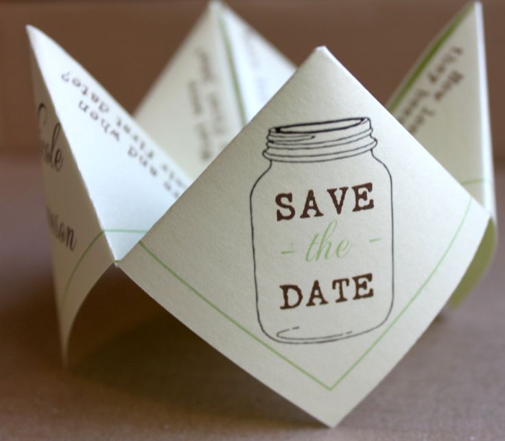 an origami save the date card with a mason jar on it