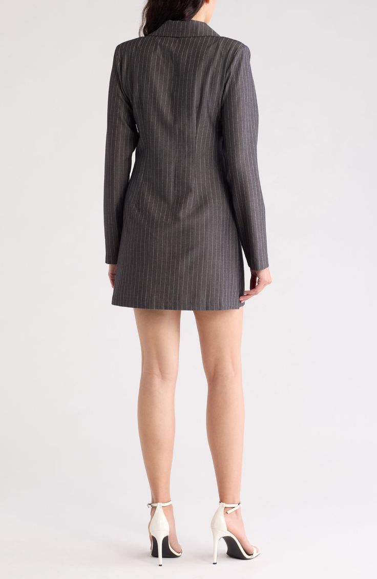 Dress to impress in this long-sleeve blazer dress featuring slender pinstripes and a flirty leg-baring silhouette. 44 1/2" length Button front closure 65% polyester 32% rayon, 3% elastane Dry clean Imported Pinstripe Blazer With Hidden Button Closure, Sleek Long Sleeve Blazer Dress For Semi-formal Occasions, Semi-formal Pinstripe Long Sleeve Blazer, Semi-formal Pinstripe Blazer With Long Sleeves, Semi-formal Long Sleeve Pinstripe Blazer, Pinstripe Blazer For Semi-formal Fall Occasions, Tailored Sleek Long Sleeve Blazer Dress, Spring Pinstripe Blazer For Formal Events, Pinstripe Blazer For Spring Formal Occasions