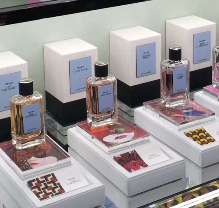 several different types of perfumes on display in a store