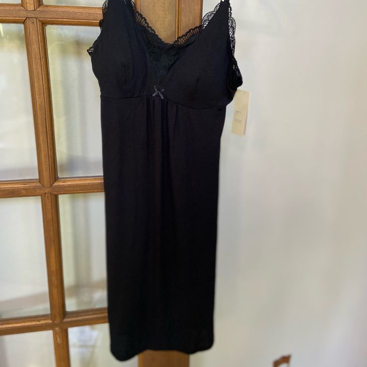 Ladies Black Night Gown With Lace Trim Elegant Black Bedtime Dress, Elegant Black Sleepwear With Spaghetti Straps, Black Camisole Nightgown For Night Out, Black Spaghetti Strap Sleepwear For Loungewear, Black Camisole Nightgown For Loungewear, Fitted Black Nightgown For Loungewear, Black Fitted Nightgown For Sleep, Elegant Black Nightgown For Bedtime, Fitted Black Nightgown For Sleep