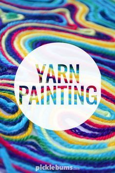 yarn painting with the word yarn painted on it in white circle surrounded by multicolored swirls