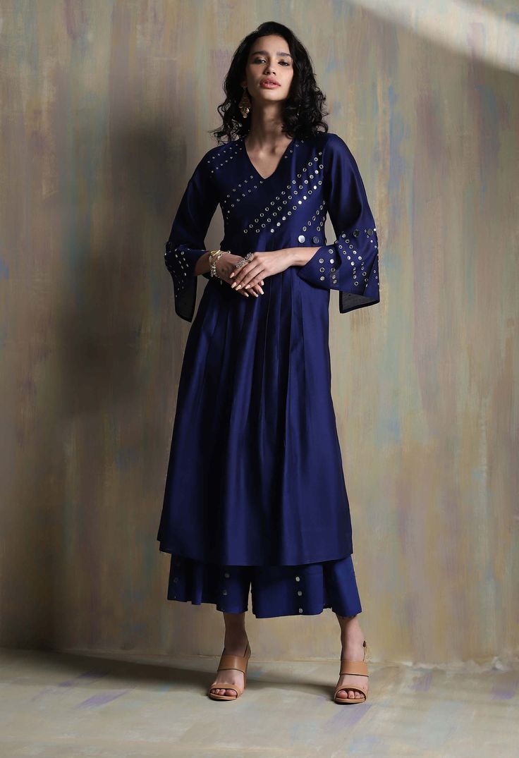 Editor's Note Chanderi Kurta With Mirror Embellished Bell Sleeves And Mirror Work On Yoke.this Kurta Set Is Paired With Chanderi Dupatta With Mirrors On Border And Cotton Palazzos Embellished With Mirrors. Fabric: Kurta: Chanderi Lining: Cotton Salwar: Cotton Dupatta: Chanderi Color: Sapphire Blue Care: Dry Clean Only About the Designer A brand that seeks inspiration in the classics while honouring minimalistic opulence. Charkhee is a label that brings to you a beautiful medley of noteworthy cra Chanderi Dupatta, White Kurta, Sustainable Clothing Brands, Circular Mirror, Palazzo Set, Blue Mirrors, Kurta Designs, Mirror Work, Kurta Set