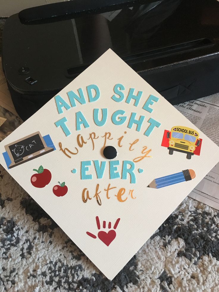 a graduation cap that says and she taught happily after