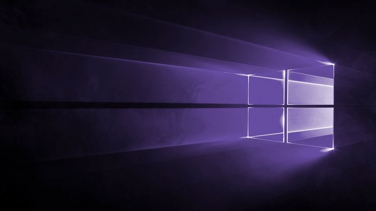 the windows 10 wallpaper is purple and black with light coming from it's center window