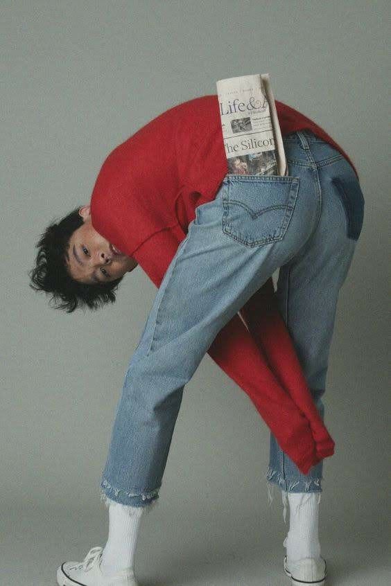 a man with his head in the back pocket of jeans