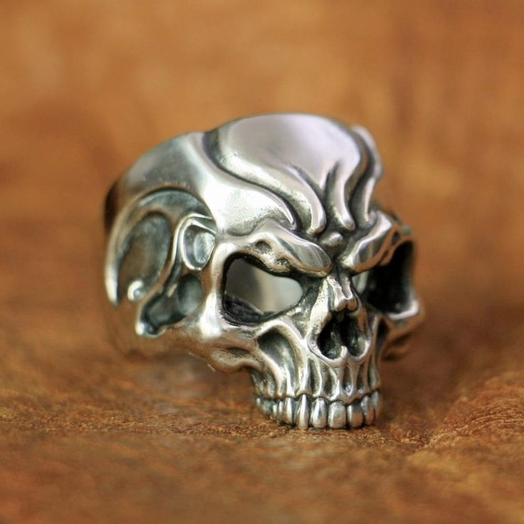 "It's a hard way to the top if you wanna rock and roll" ac/dc ! this silver skull ring will take you to the top, my friend! Are you a fan of rock? Like to listen or play to rock? Then these sterling silver rock rings is made for you. With this masterpiece on your finger, you can be sure that you will feel the power and the spirit of the greatest rockers ever through your veins. As you may have noticed, this skeleton head is well detailed with beautiful engravings all over the forehead, the sharp Punk Skull Ring For Streetwear, Punk Skull Ring For Halloween, Punk Style Skull Ring For Halloween Collectible, Punk Skull Ring For Halloween Streetwear, Silver Punk Skull Ring For Halloween, Silver Skull Ring For Halloween Streetwear, Silver Edgy Skull Ring For Halloween, Edgy Silver Skull Ring For Halloween, Silver Skull Ring For Halloween