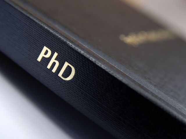 a black book with the word phd on it