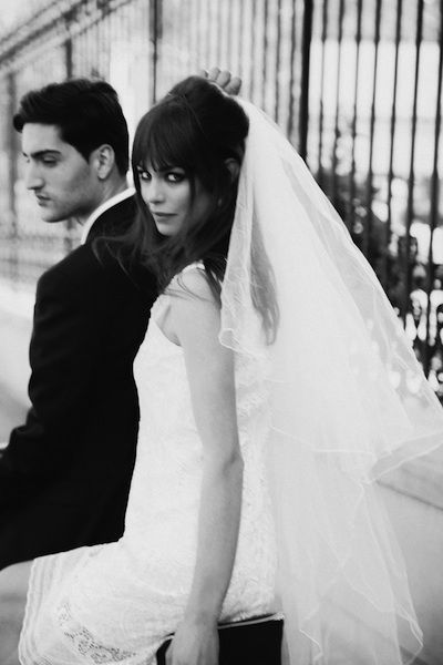 a bride and groom standing next to each other