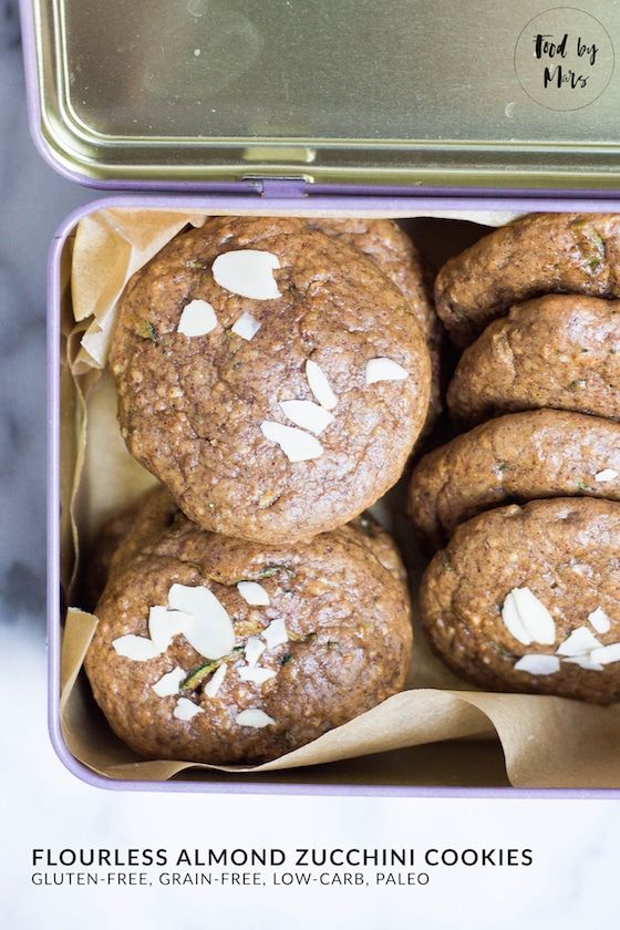 a tin filled with cookies sitting on top of a table