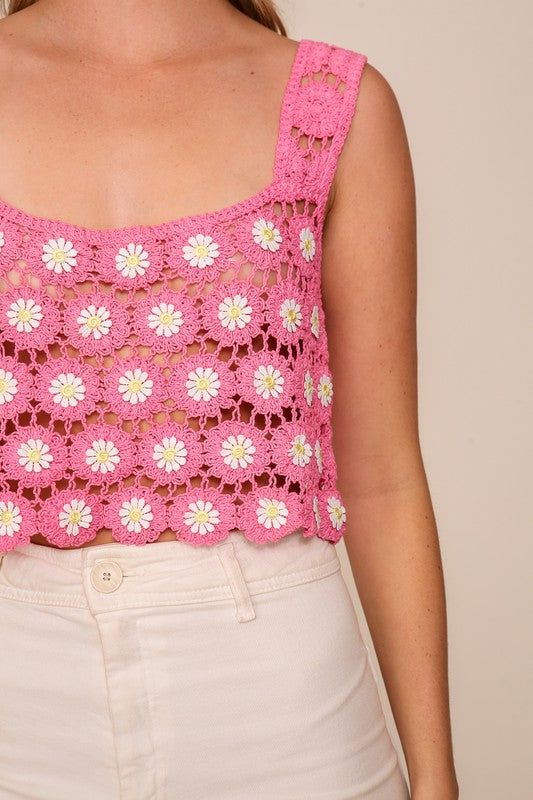 A delightful crochet top adorned with beautiful flower, trimmings, featuring a charming square, neckline and elegantly sleeveless design. Wear over a bathing suit at the beach to a festival or vacation. Pair with white wide leg jeans or shorts. Square Neck Crop Top For Spring Vacation, Casual Square Neck Crop Top For Beach, Fitted Tank Top For Spring Beach Party, Sleeveless Trendy Crochet Top For Beach Season, Spring Beach Crop Top With Square Neck, Trendy Sleeveless Crochet Top For Beach Season, Crochet Tank Top For Beach Vacation, Crochet Tank Top For Summer Vacation, Summer Sleeveless Crochet Top