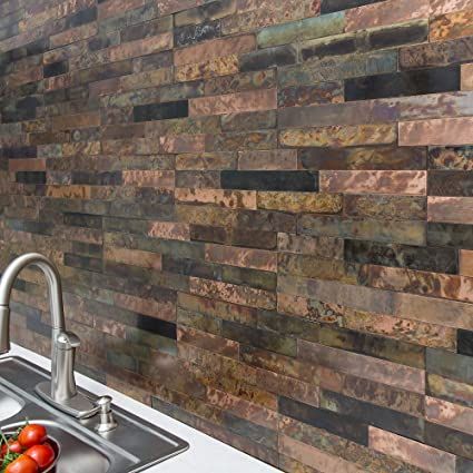 a kitchen sink sitting under a faucet next to a wall mounted tile backsplash