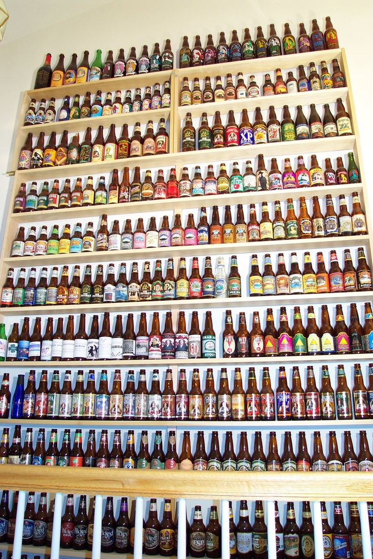 a wall filled with lots of beer bottles