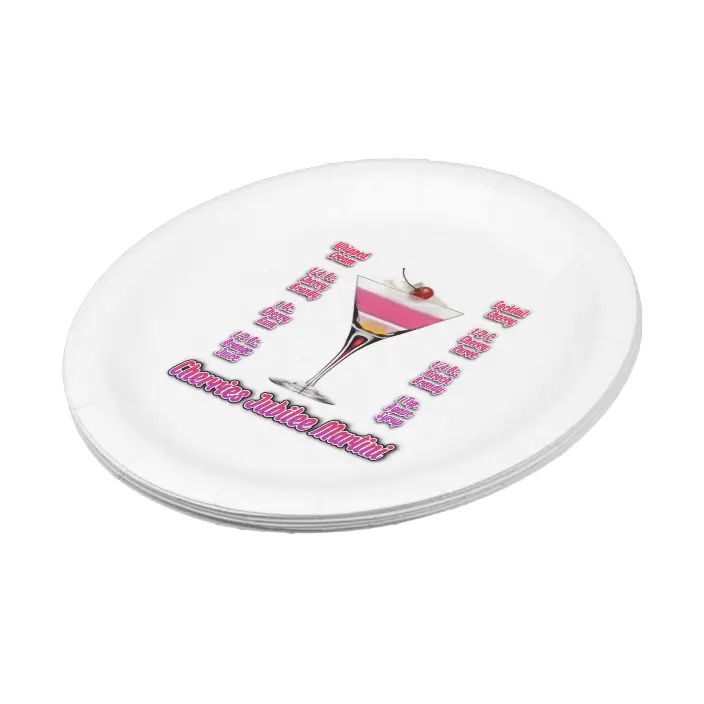 a white plate with pink lettering and a martini glass in the center, on a white background