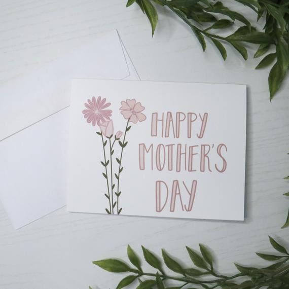 a mother's day card with pink flowers and green leaves on the left side