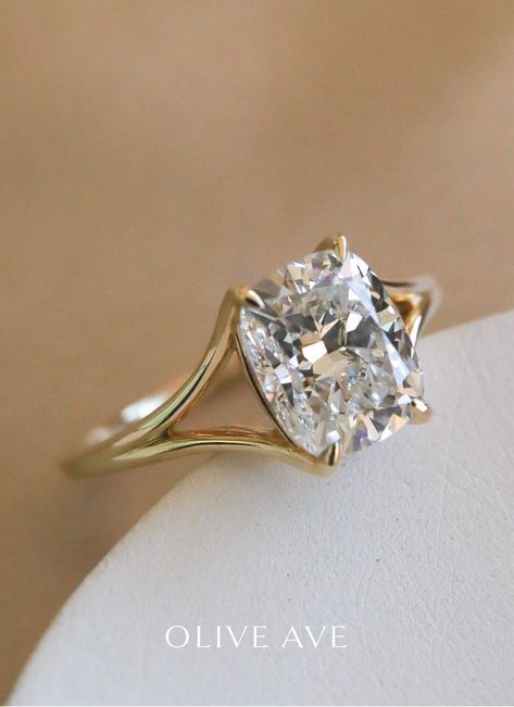 a close up of a ring with a diamond