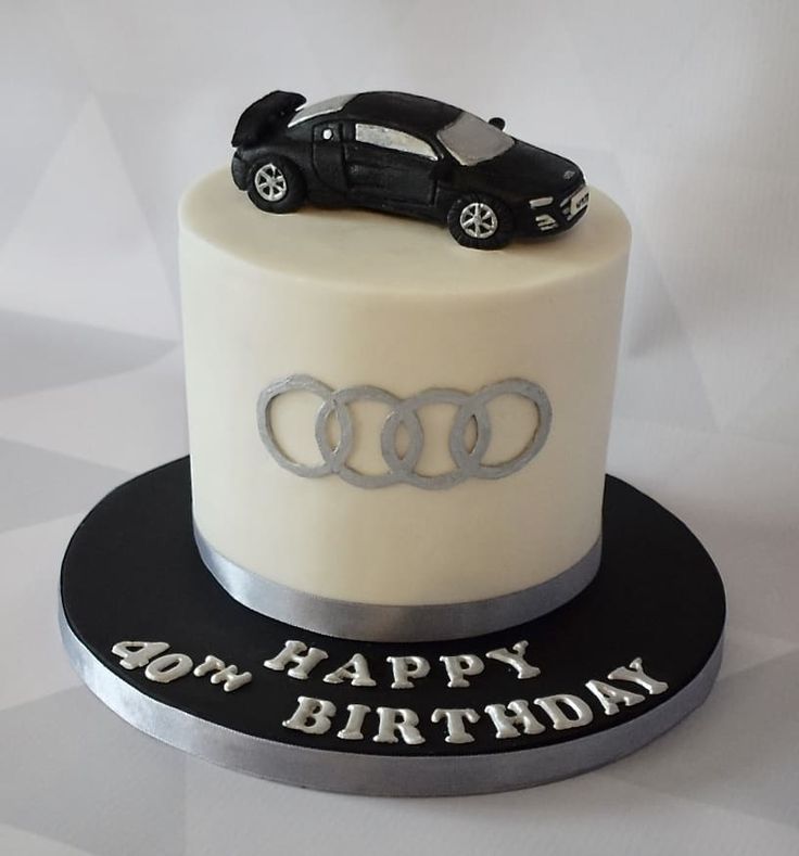 a birthday cake with an audi car on top