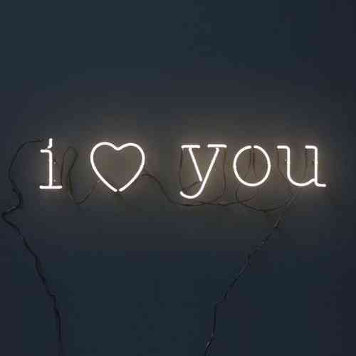 the word i love you written in neon lights