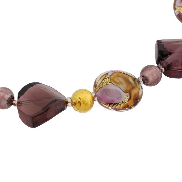 Tender and feminine, elegant and rich, this Murano Glass necklace is so beautiful it is guaranteed to appeal to all tastes and styles. Crafted by hand in a family glass-making workshop on Murano Island, this necklace captures a piece of beautiful Venice and brings artisanal passion to life. Not only is this necklace finely crafted reflecting the rare skill of the master glass-makers, but it also has the most beautiful shades of purple, pink and gold. Luminous beads in different shapes dot this n Luxury Glass Jewelry For Party, Elegant Beaded Necklaces With Unique Variations For Gift, Murano Glass Round Necklace For Gifts, Murano Glass Round Necklaces For Gifts, Elegant Glass Jewelry For Party, Elegant Purple Round Beaded Necklaces, Murano Glass Single Strand Necklace As Gift, Elegant Murano Glass Necklace For Gift, Elegant Murano Glass Necklaces For Gift