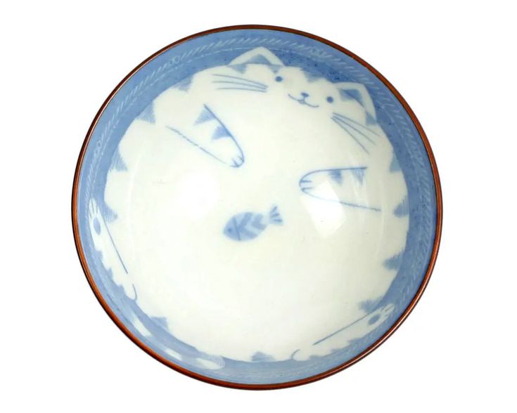 a blue and white bowl with a cat on it