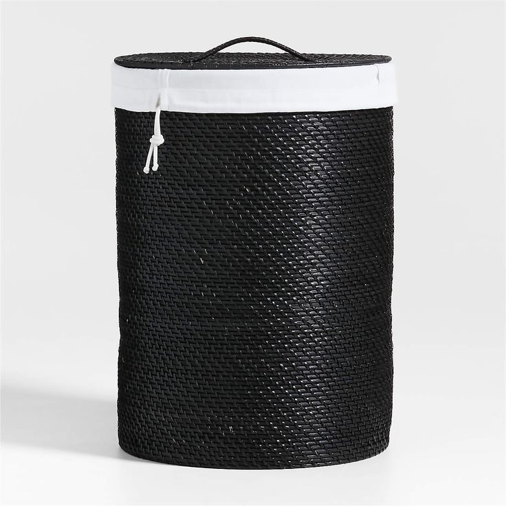 a black and white laundry hamper on a white background with the lid closed up