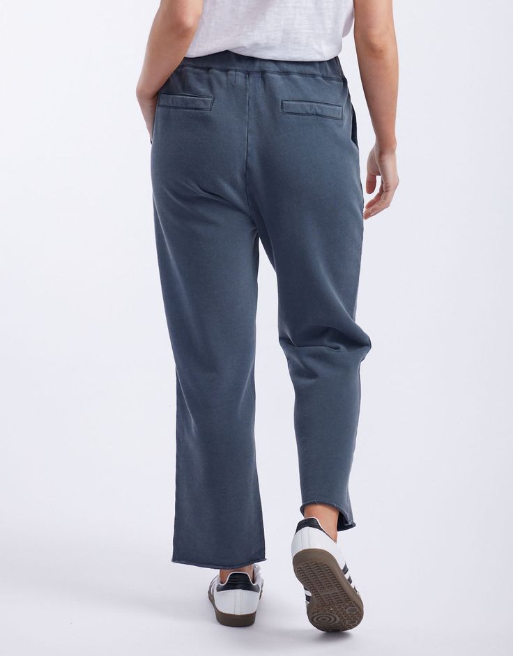 DESCRIPTION Ultra comfortable and oh-so-stylish, you'll love the Raw Edge Lounge Pant from White & Co. Crafted from super soft un-brushed French Terry, these lounge pants are an everyday must-have! These stylish pants feature an elastic waistband, relaxed straight-leg silhouette, front patch pockets and back jet pockets. Considered details like the matching drawcord, top stitch detail colour pop bar tack detail and raw finished hem elevate these weekend essentials. Still browsing? Discover our f Casual Wide Leg Soft-washed Bottoms, Relaxed Fit Bottoms With Comfort Waistband For Lounging, Casual Cotton Lounging Bottoms, Casual Cotton Bottoms For Lounging, Comfort Waistband Bottoms With Straight Hem For Lounging, Soft-washed Wide Leg Loungewear Pants, Soft-washed Pants For Fall Loungewear, Casual Soft-washed Sweatpants For Loungewear, Soft-washed Loungewear Pants For Fall