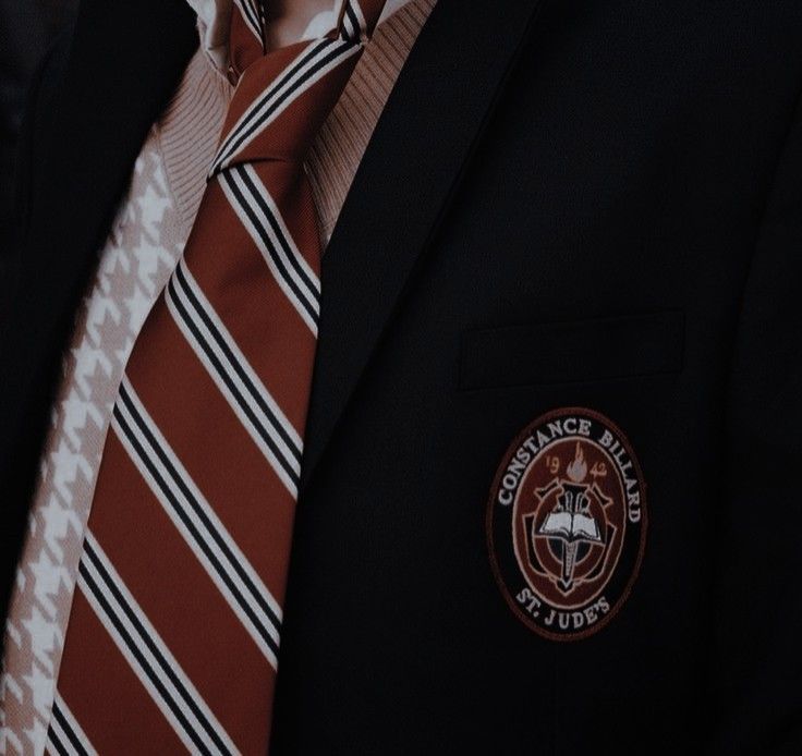 a man wearing a suit and striped tie