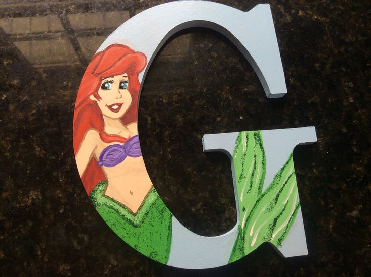 the letter c is painted to look like ariel from the little mermaid