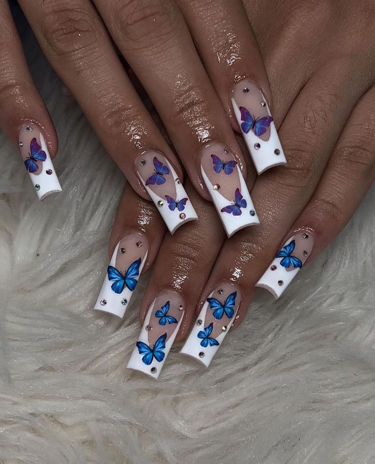 Butterfly Nail Art Cute Acrylic Nails Butterfly, Short Nail Designs Blue Butterfly, Nail Idea Butterfly, Butterfly And Rhinestone Nails, Blue And Butterfly Nails, Clear Nails With Butterfly Design, Gel X Butterfly Nails, Cute Nails Butterflies, Butterfly Nail Stickers Designs