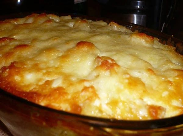 a casserole dish sitting on top of a wooden table