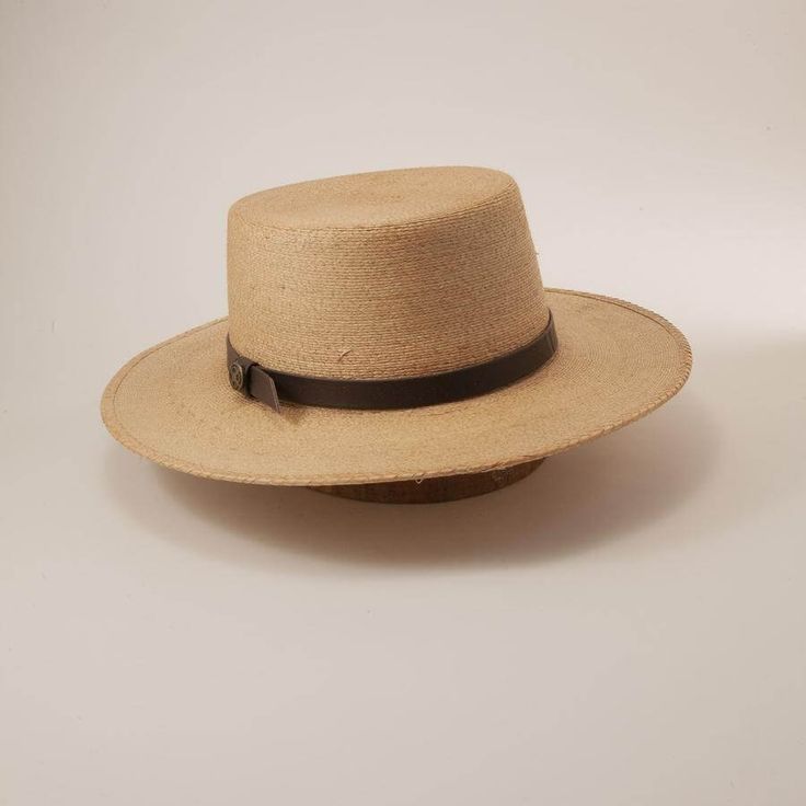 Description The Wide Brim Straw Sun Hat - Cozumel for Men & Women is inspired by hats worn by gondoliers in Venice. The Cozumel Sun Hat has a stiff flat crown and brim with a genuine leather hatband. The lightweight construction and tightly woven pattern make it an excellent accessory for a morning on the water. Wide Brim Straw Sun Hat - Cozumel for Men & Women works just as well afternoon at a social gathering, or an evening... drinking a cold one with your pals. Brim 3" Crown 4" Featherweight Country Style Flat Brim Boater Hat For Rodeo, Country Style Boater Hat With Flat Brim For Rodeo, Natural Toquilla Straw Boater Hat With Flat Brim, Kentucky Derby Toquilla Straw Boater Hat With Flat Brim, Classic Wide Brim Top Hat For The Beach, Brimmed Toquilla Straw Boater Hat For Kentucky Derby, Classic Adjustable Brimmed Boater Hat, Natural Toquilla Straw Hat With Flat Crown, Adjustable Natural Color Fedora With Flat Crown