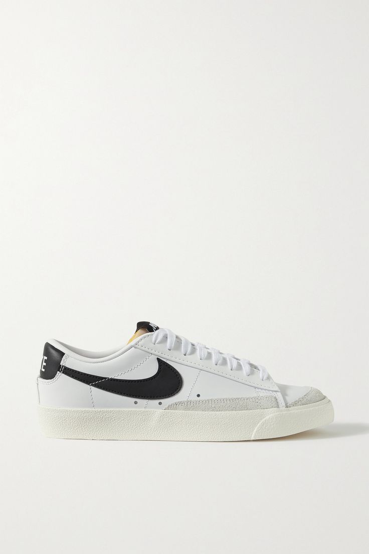 Modeled after archival styles, Nike updates its 'Blazer Low '77 SE' sneakers with gray suede trims. They're made from supple white leather and detailed with a black 'Swoosh', topstitching and the label's printed moniker. Nike Blazer Mid 77 Low, Low Top Nike Blazers, Nike 77 Blazer, Low Top Blazers, Nike Blazers Low, Nike 77, Nike Blazer Black, Low Top Nikes, Nike Blazer Low 77