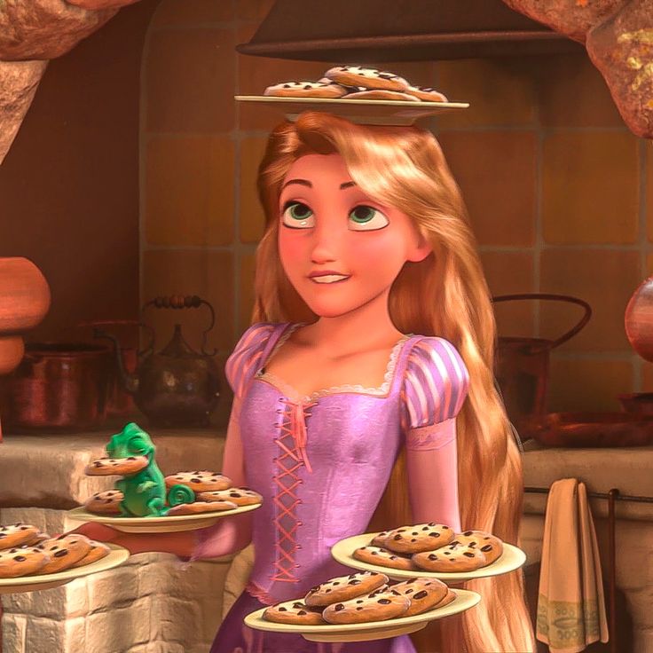 the princess is holding some cookies in her hand