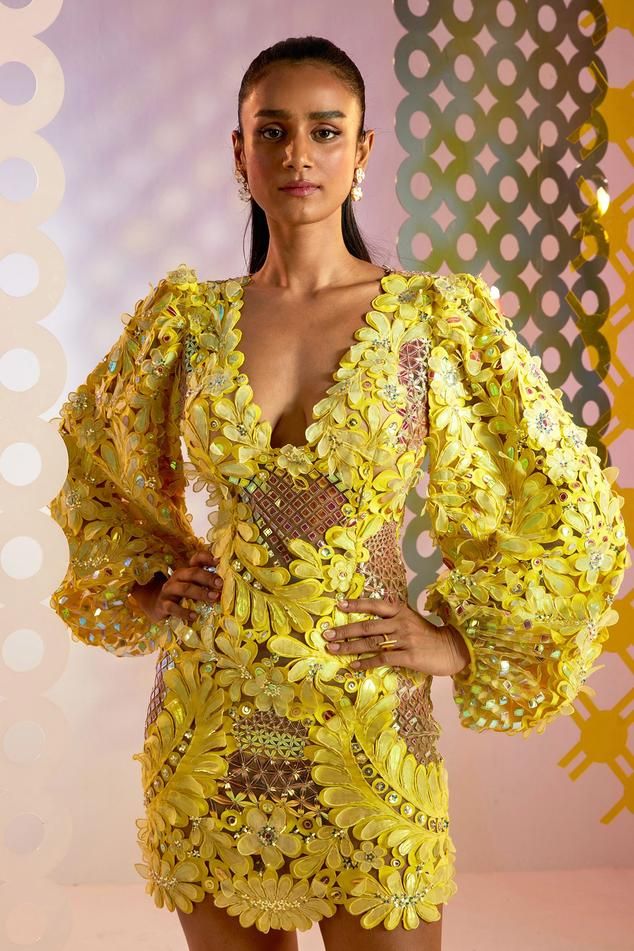 Yellow hand embellished dress with floral cutwork detail and puff sleeves
Component: 1
Pattern: Hand embellished
Type Of Work: 3D floral applique
Neckline: V neck
Sleeve Type: Puff sleeves
Fabric: Tulle
Color: Yellow
Other Details: 
Back cutout detail
Back zipper closure
Occasion: Party, Resort - Aza Fashions Festive Organza Dress With Floral Applique, Festive Floral Applique Organza Dress, Festive Couture Embellished Dresses, Hand Embellished Dresses For Evening In Spring, Festive Embellished Couture Dresses, Hand Embellished Evening Dress For Spring, Yellow Hand Embellished Dress For Festive Occasions, Hand Embellished Long Sleeve Organza Dress, Party Dresses With Embroidered Sleeves In Organza