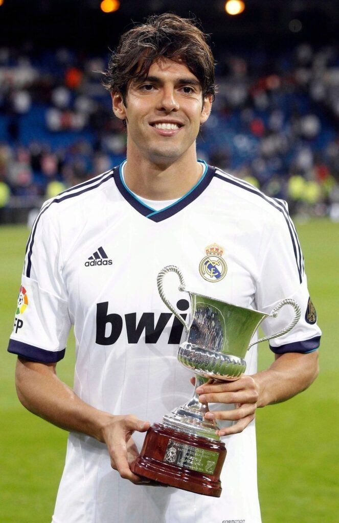 a man holding a trophy in his hands