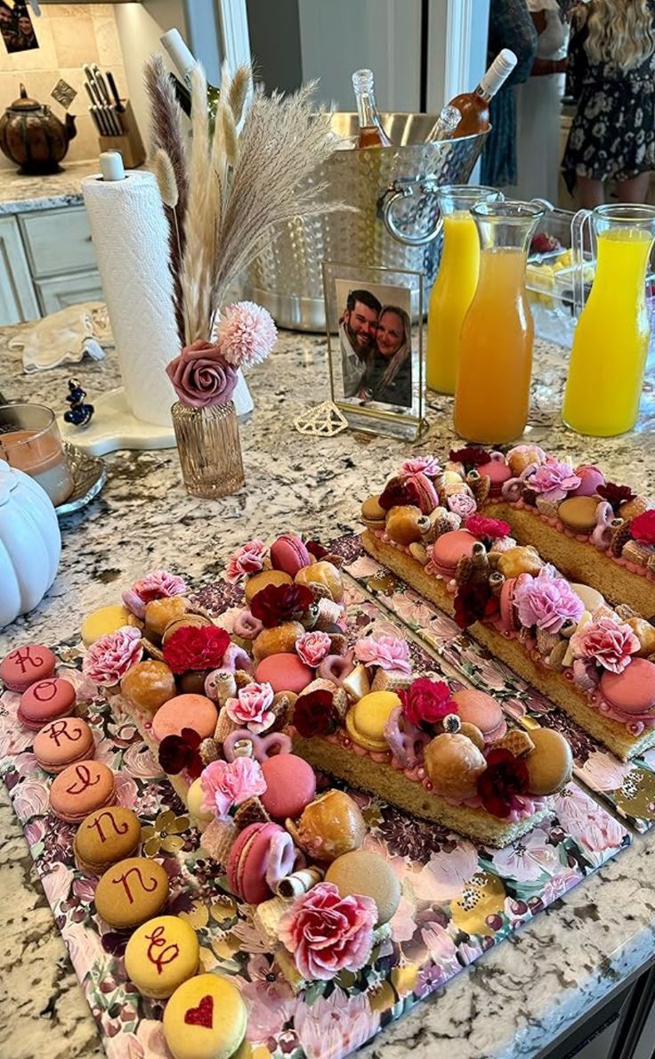 a table topped with lots of different types of cakes and pastries on top of it