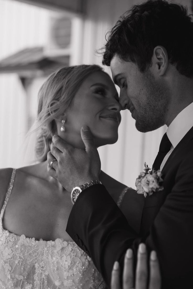 a bride and groom pose for a wedding photo