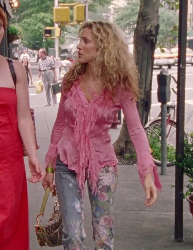 two women walking down the street holding hands