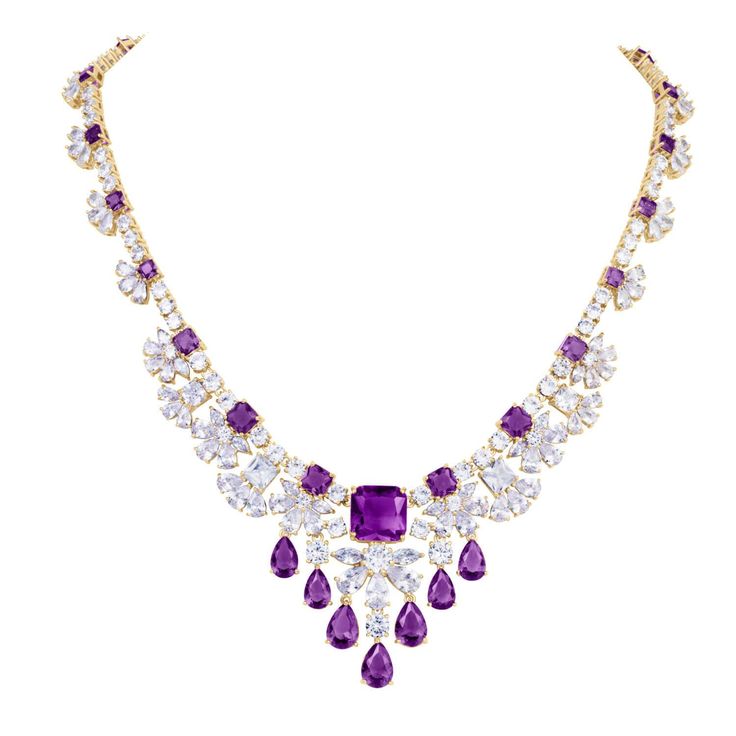 This charming collection is perfect for a special occasion. A cascade of ice white and vivid violet shimmer across your neckline and sparkle from your earlobe. Just over 80 carats of these delightful gems in classic cushion, pear and round cuts are handset into this piece. Finished in luxurious 18k yellow gold, adds the final touch to this superb collection. Luxury Purple Diamond Necklace, Glamorous Purple Jewelry For Evening, Elegant Purple Jewelry For Evening, Elegant Purple Evening Jewelry, Luxury Cushion Cut Cubic Zirconia Necklace, Luxury Cubic Zirconia Cushion Cut Necklace, Luxury Purple Cushion Cut Jewelry, Dazzling Purple Wedding Jewelry, Luxury Purple Jewelry For Wedding