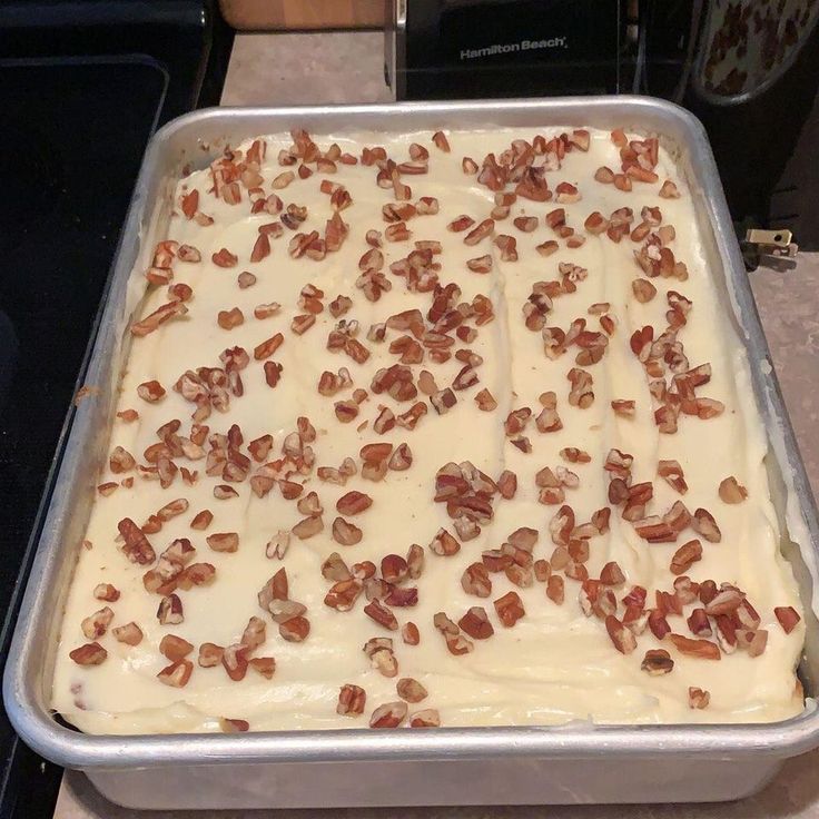 a pan filled with food sitting on top of a counter next to an electric stove