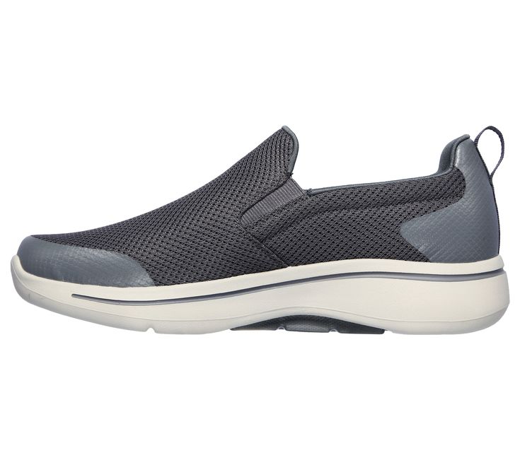 A classic walking style gets even more supportive comfort in the Skechers GO WALK Arch Fit - Togpath shoe. This pull-on sneaker features an athletic engineered mesh upper with removable Arch Fit insole and a lightweight ULTRA GO cushioned midsole. | Skechers Men's GOwalk Arch Fit - Togpath Slip-On Shoes Walking Slip-on Sneakers With Arch Support, Sporty Slip-on Sneakers With Arch Support For Walking, Functional Low-top Slip-on Sneakers For Walking, Slip-on Sneakers For Walking With Arch Support, Functional Slip-on Walking Shoes With Ortholite Insole, Slip-on Sneakers With Arch Support For Walking, Ortholite Slip-on Walking Shoes For Sports, Slip-on Ortholite Insole Walking Shoes For Sports, Slip-on Walking Shoes With Ortholite Insole For Sports