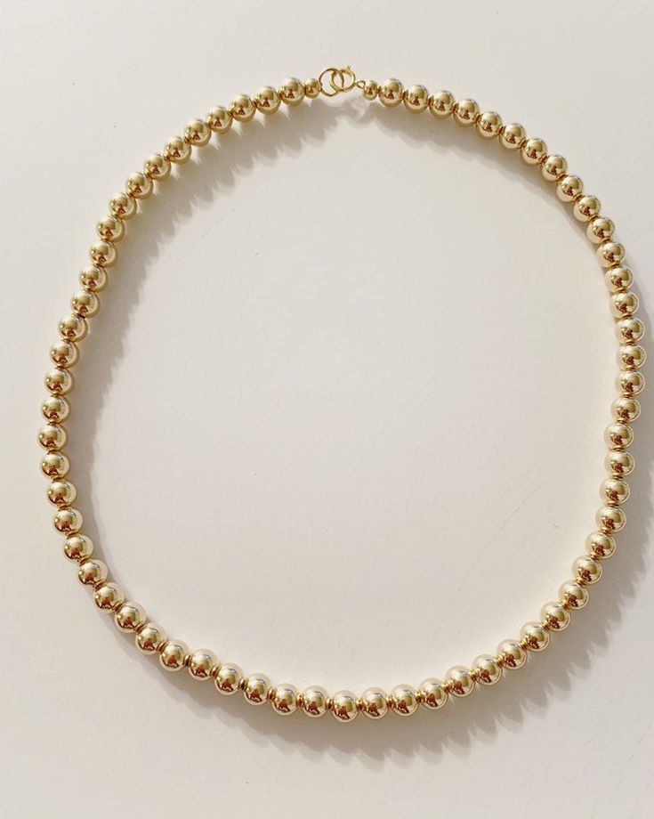 This listing is for a beaded necklace with 14k gold beads. Bead size shown here is 3mm. The beads are available in sizes 2mm to 6mm. Clasp is also 14k gold filled. If you want to see the difference in size of beads please send me a message. Please note the 2mm are very tiny, the size of seed beads from a craft store. Most popular sizes I sell are 3mm and 4mm. please review my shop policies regarding returns, shipping, and international shopper info before purchasing. Dainty Beaded Necklaces With Gold Beads, Dainty Gold Beaded Necklaces, Adjustable Round Bead Gold-filled Necklace, Adjustable Gold Choker With Round Beads, Beaded 14k Gold Filled Necklace With Round Beads, Beaded 14k Gold Filled Round Necklaces, 14k Gold Filled Beaded Necklaces With Round Beads, Adjustable 14k Gold-filled Beaded Necklaces, Adjustable 14k Gold Filled Beaded Necklace