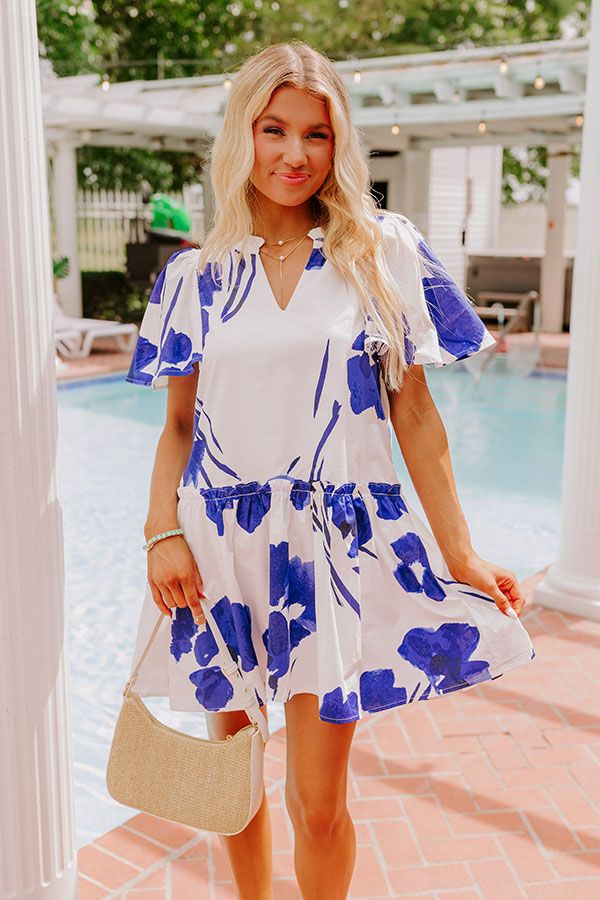 - Stay polished and pretty in this darling dress! Designed with a beautiful floral print and ruffle detailing, this piece is perfect for stylish days under the sun. - Fully lined material with a blue hued abstract floral print - A v-cut neckline with gathered detailing - Short loose sleeves - A relaxed silhouette that ends in a straight mini dress length hemline Catalina Island, Loose Sleeves, Abstract Floral Print, Darling Dress, V Cut, V Cuts, Floral Mini Dress, Abstract Floral, Xl Dress